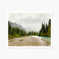 Art print of a scenic landscape of a river with trees and foggy mountains on a white background