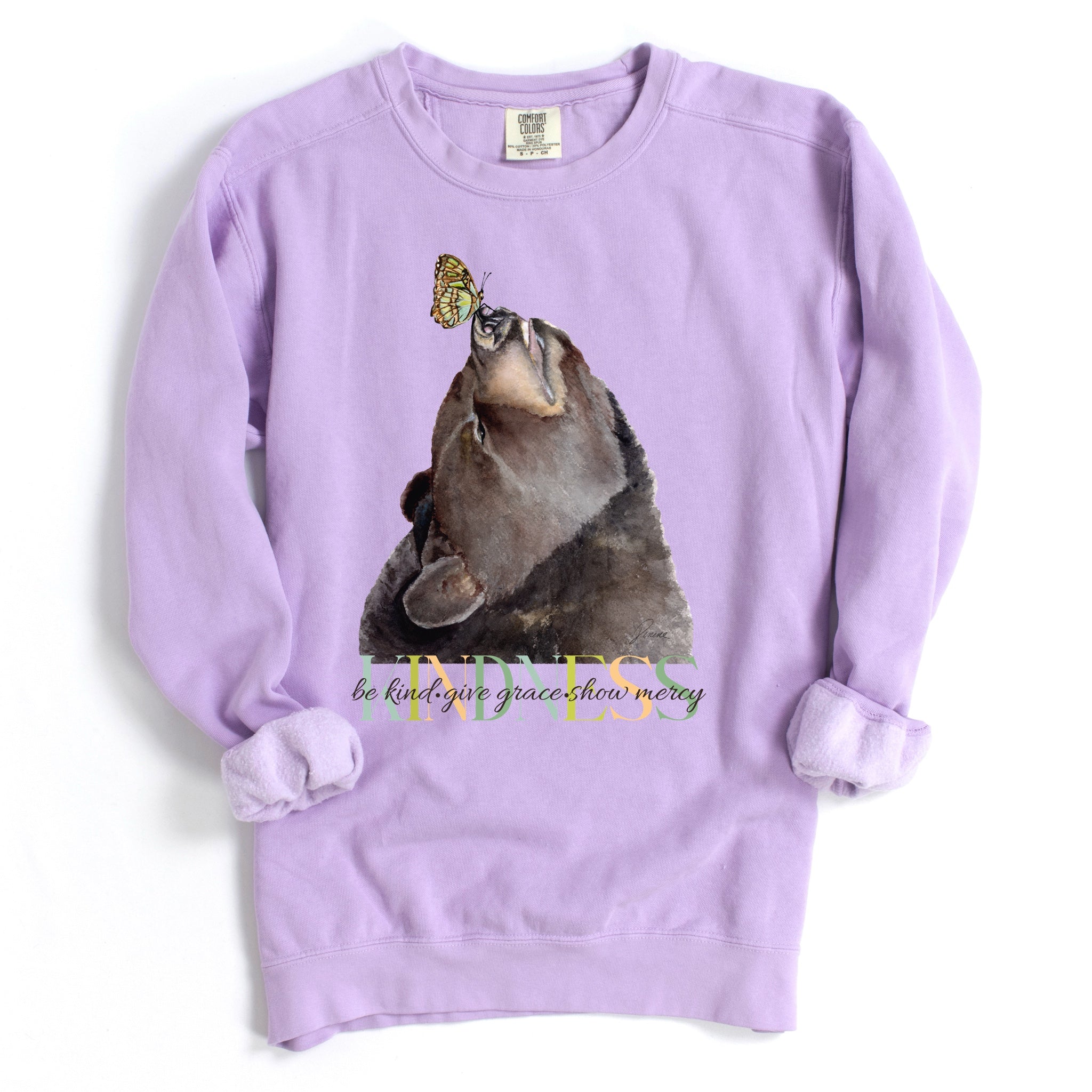 Orchid colored sweatshirt with bear and butterfly graphic with 'kindness. be kind. give grace. show mercy' text.