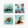 A set of four art prints depicting a manatee, an octopus, a sea turtle, and a sea lion, with a stylized blue and green oceanic background.