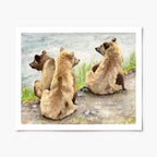 Art print of three bear cubs sitting side by side with their backs towards the viewer, looking out over a body of water.